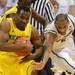 Michigan senior Eso Akunne guards the ball around Michigan State junior Adreian Payne during the second half at Breslin Center in East Lansing on Tuesday, Feb. 12. Melanie Maxwell I AnnArbor.com